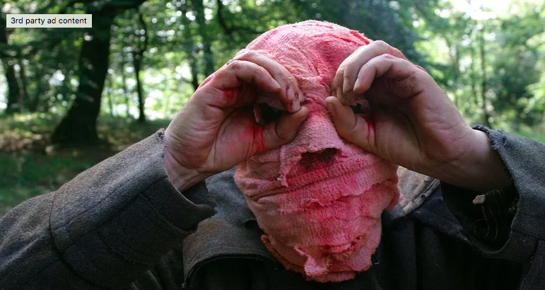 A man with pink bandages on his head from Time Crimes.