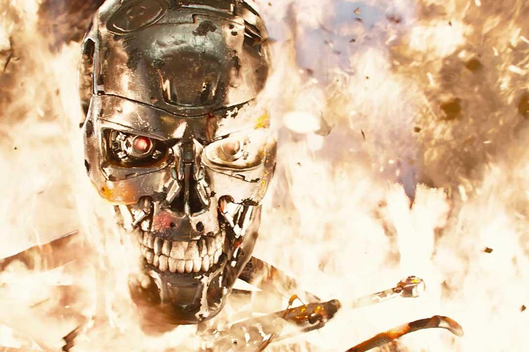 A picture of a robot face from the film The Terminator, surrounded by fire.